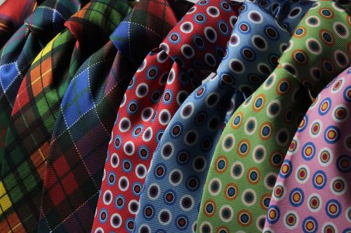 an assortment of colored ties
