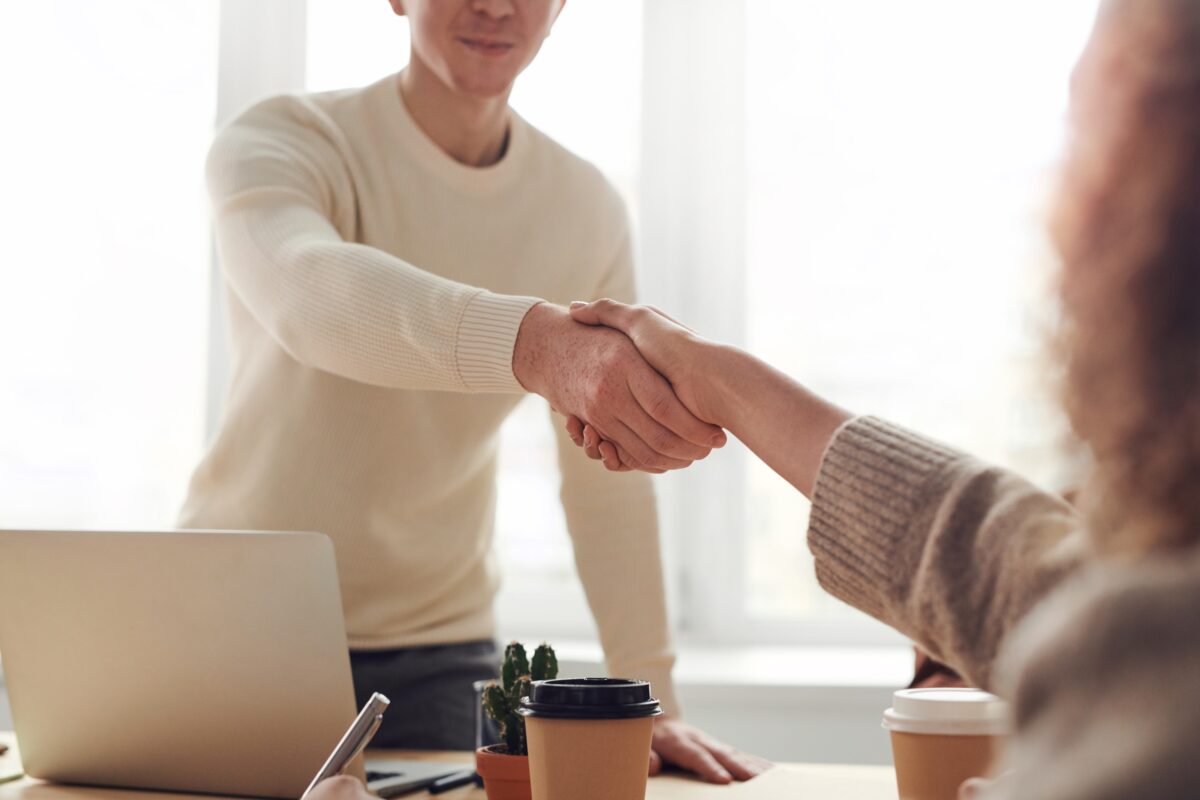 A lead generation specialist shaking hands with a client